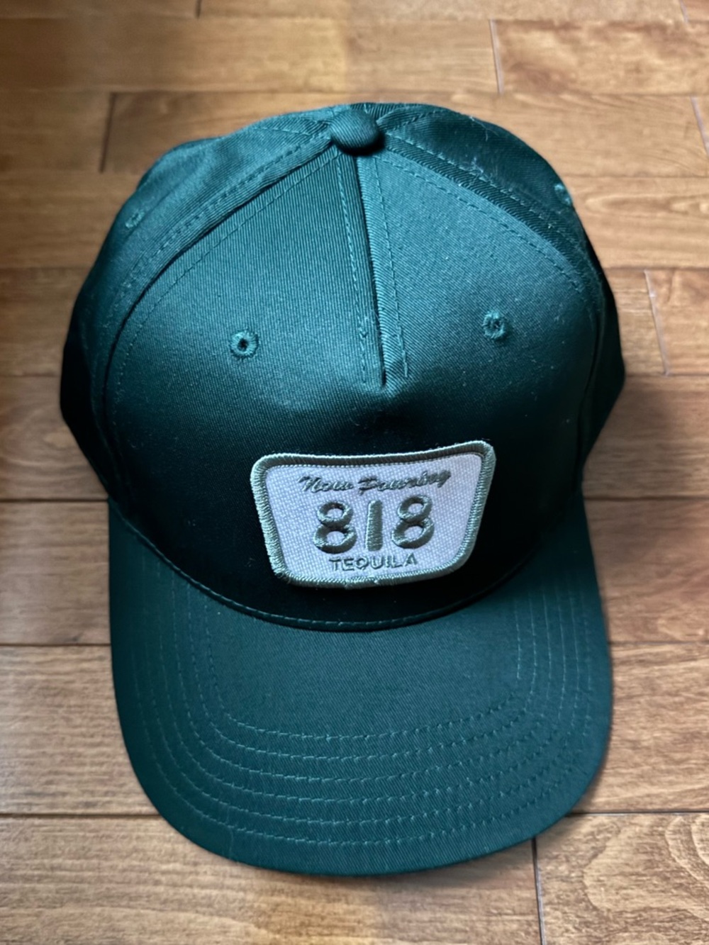 Now Pouring 818 Tequila Patch Cap in Dark Green
